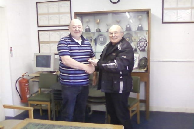 Hywel Jones receiving his trophy from Bill Phelps