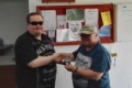 Stuart Clare is presented with his 2nd place medal.